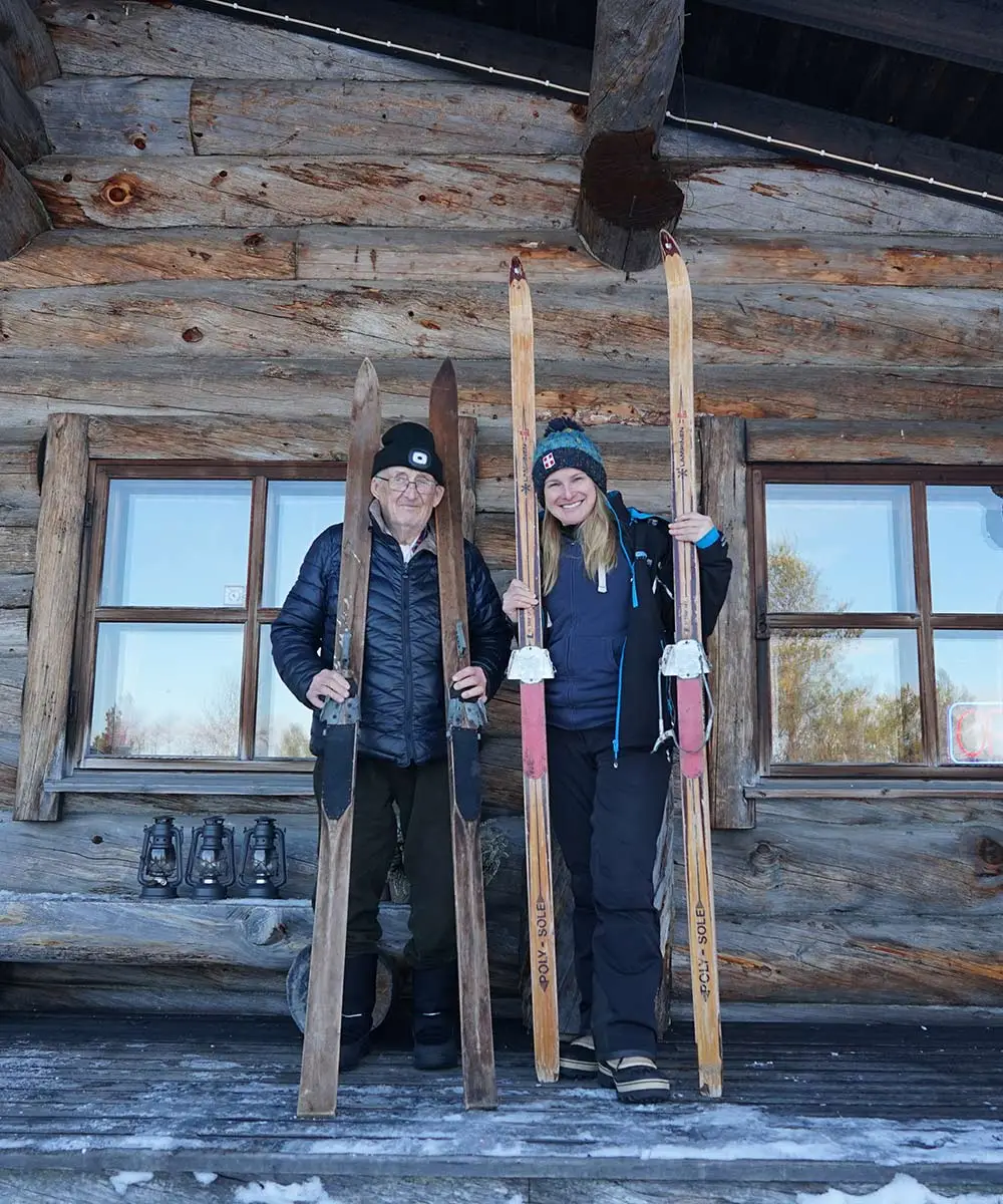 Hans Niittyvuopio and Kinga standing together in front of the main house